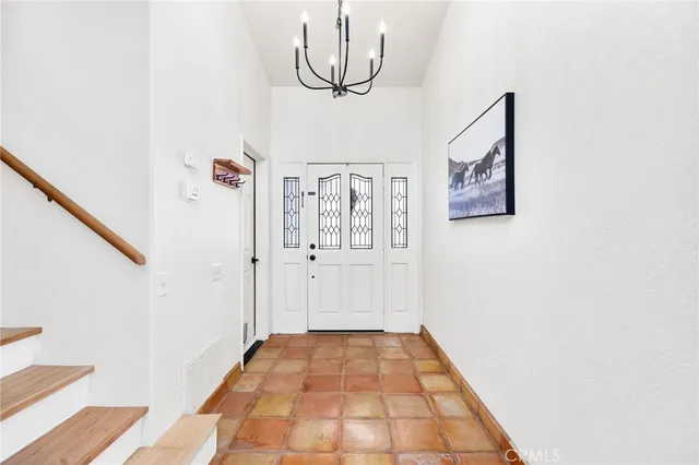 a view of a hallway with front door