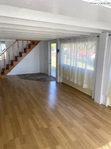 a view of entryway with wooden floor
