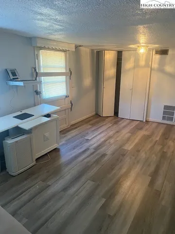 a room with a bed and a window