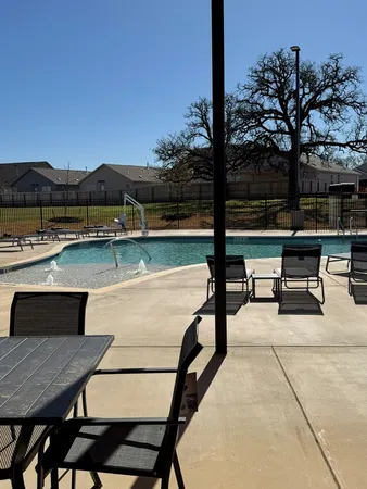 a terrace with outdoor seating and city view
