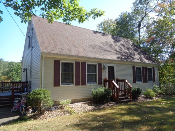 220 Dana Road Orange, MA 01364 - Photo 1 of 9 a view of a house with backyard sitting area and garden