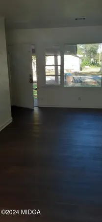 a view of an empty room and window