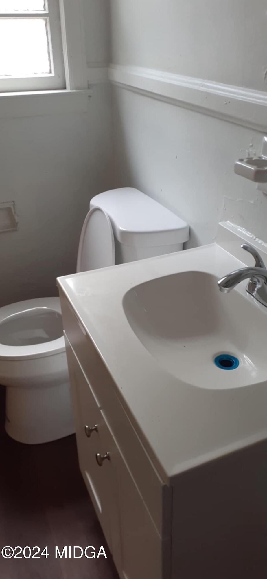 2846 Walker Street Columbus, GA 31903 - Photo 10 of 16 a bathroom with a sink and a toilet