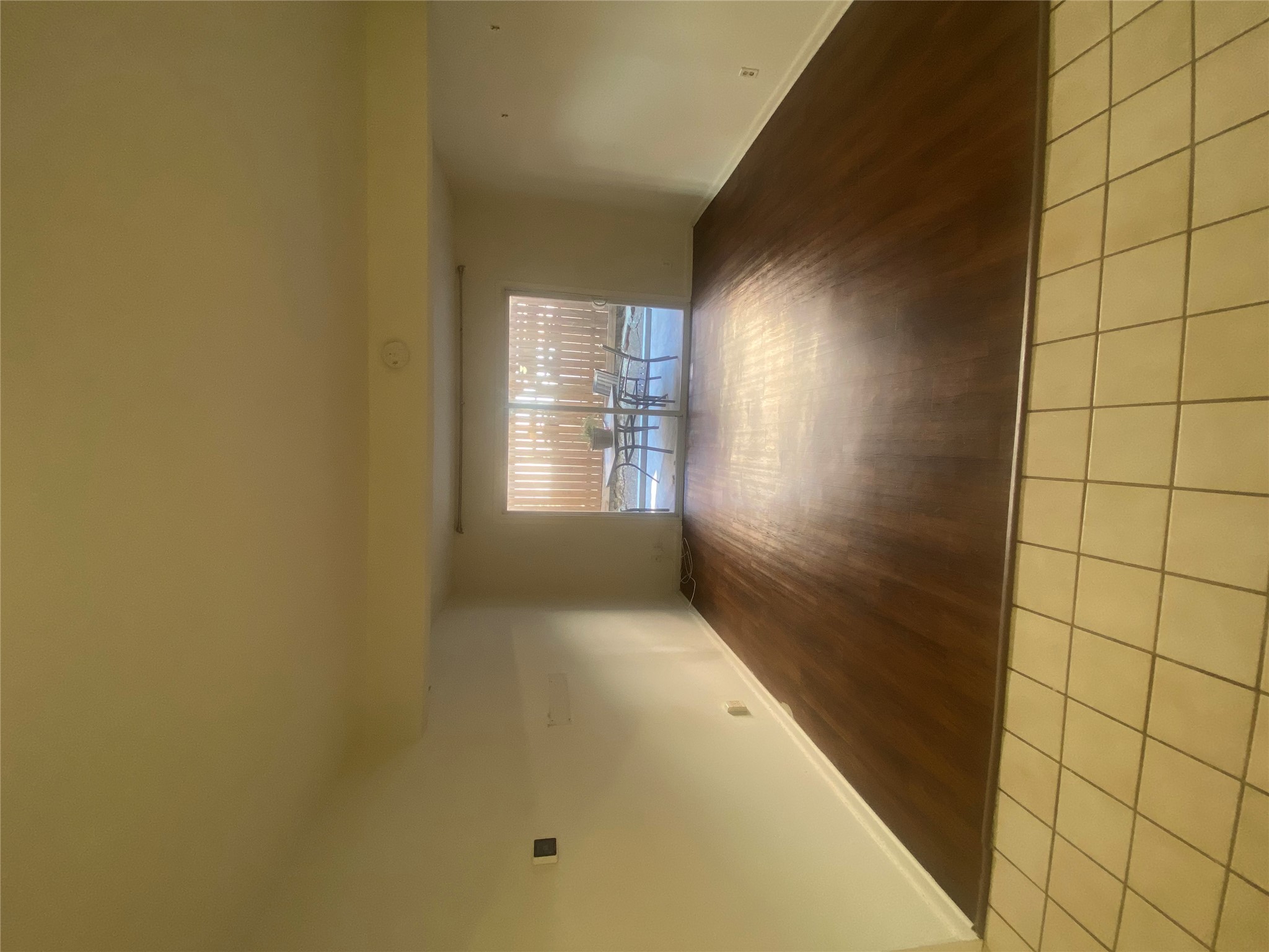 2208 Enfield Road, Unit 10500 Austin, TX 78703 - Photo 3 of 7 Spare room featuring baseboards and light wood finished floors