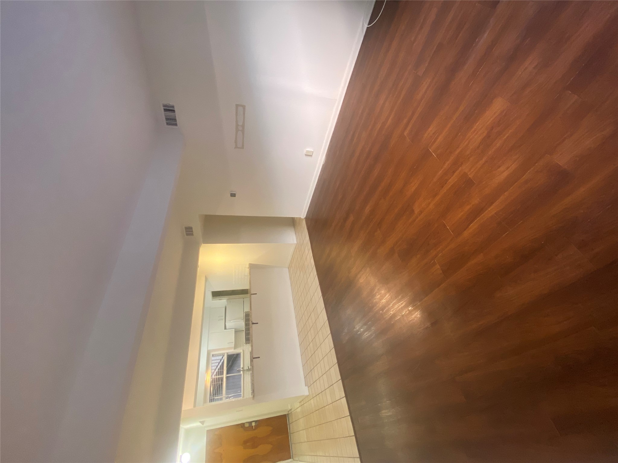 2208 Enfield Road, Unit 10500 Austin, TX 78703 - Photo 4 of 7 Unfurnished living room with wood finished floors and baseboards