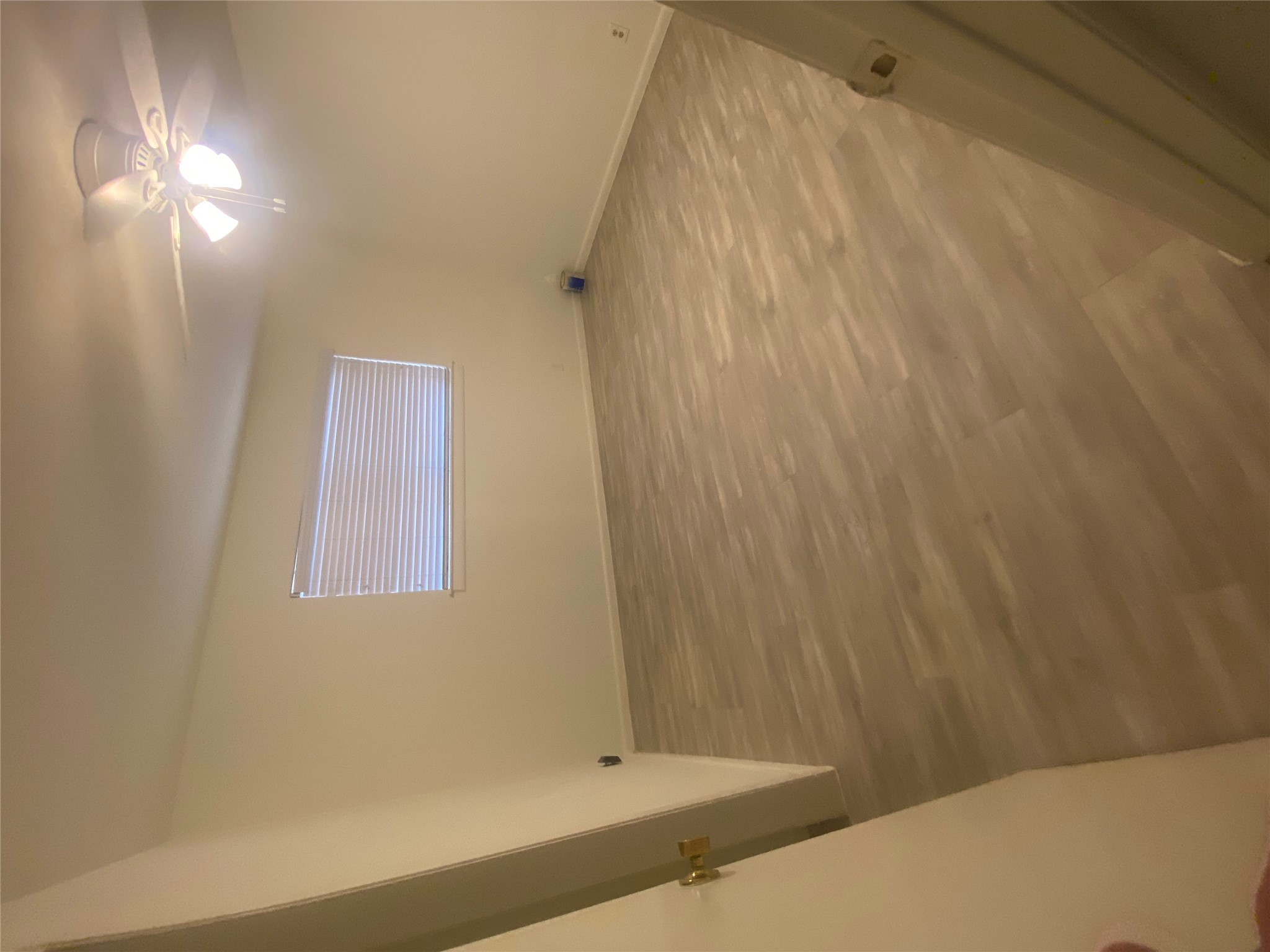 2208 Enfield Road, Unit 10500 Austin, TX 78703 - Photo 5 of 7 Empty room featuring wood finished floors and ceiling fan