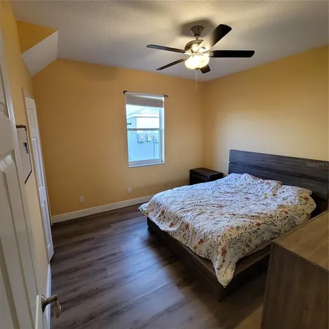 a bathroom with a sink a toilet a mirror a vanity and shower