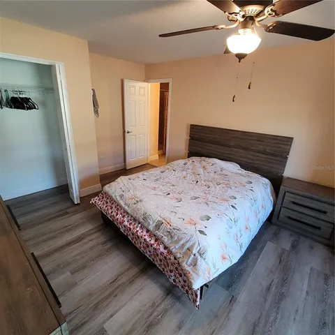 a bathroom with a sink a toilet a mirror and vanity