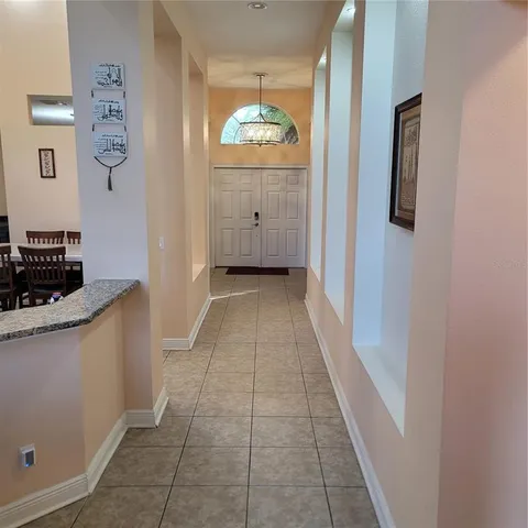 a kitchen with a refrigerator and a stove