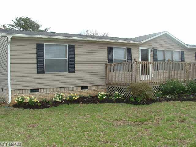1050 Hill Road King, NC 27021 - Photo 2 of 15 Exterior Front. Stop and smell the flowers!