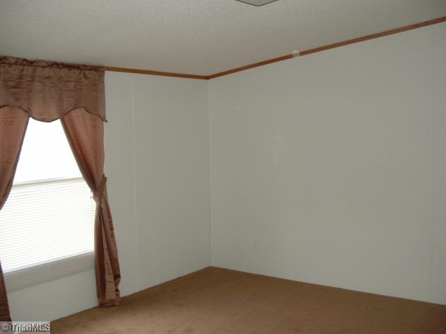 1050 Hill Road King, NC 27021 - Photo 8 of 15 Master Bedroom. Master Suite with Brand New Carpets and Drapes plus Fresh Paint!!