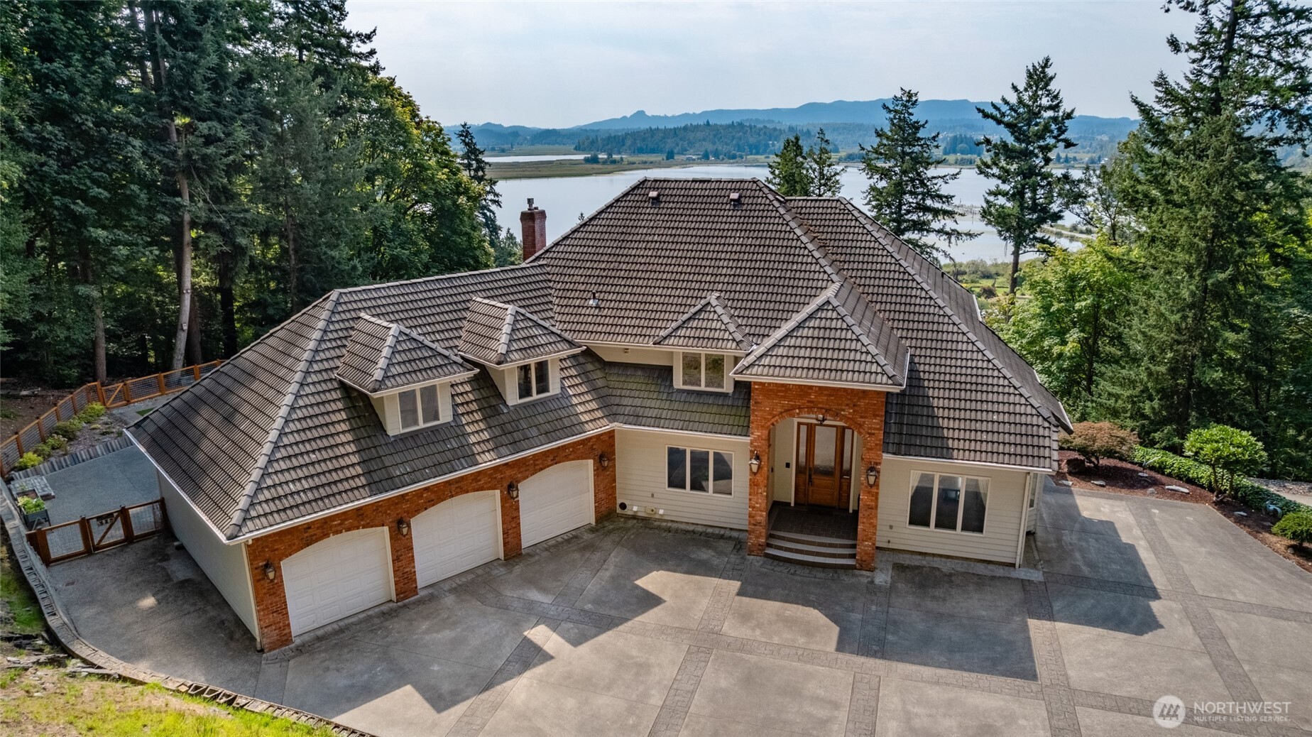 24123 Old Day Creek Road Sedro-Woolley, WA 98284 - Photo 1 of 40 a view of a house with a roof deck
