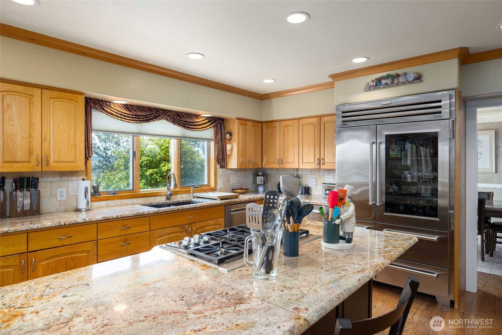 24123 Old Day Creek Road Sedro-Woolley, WA 98284 - Photo 12 of 40 a kitchen with granite countertop a stove a sink and a dining table