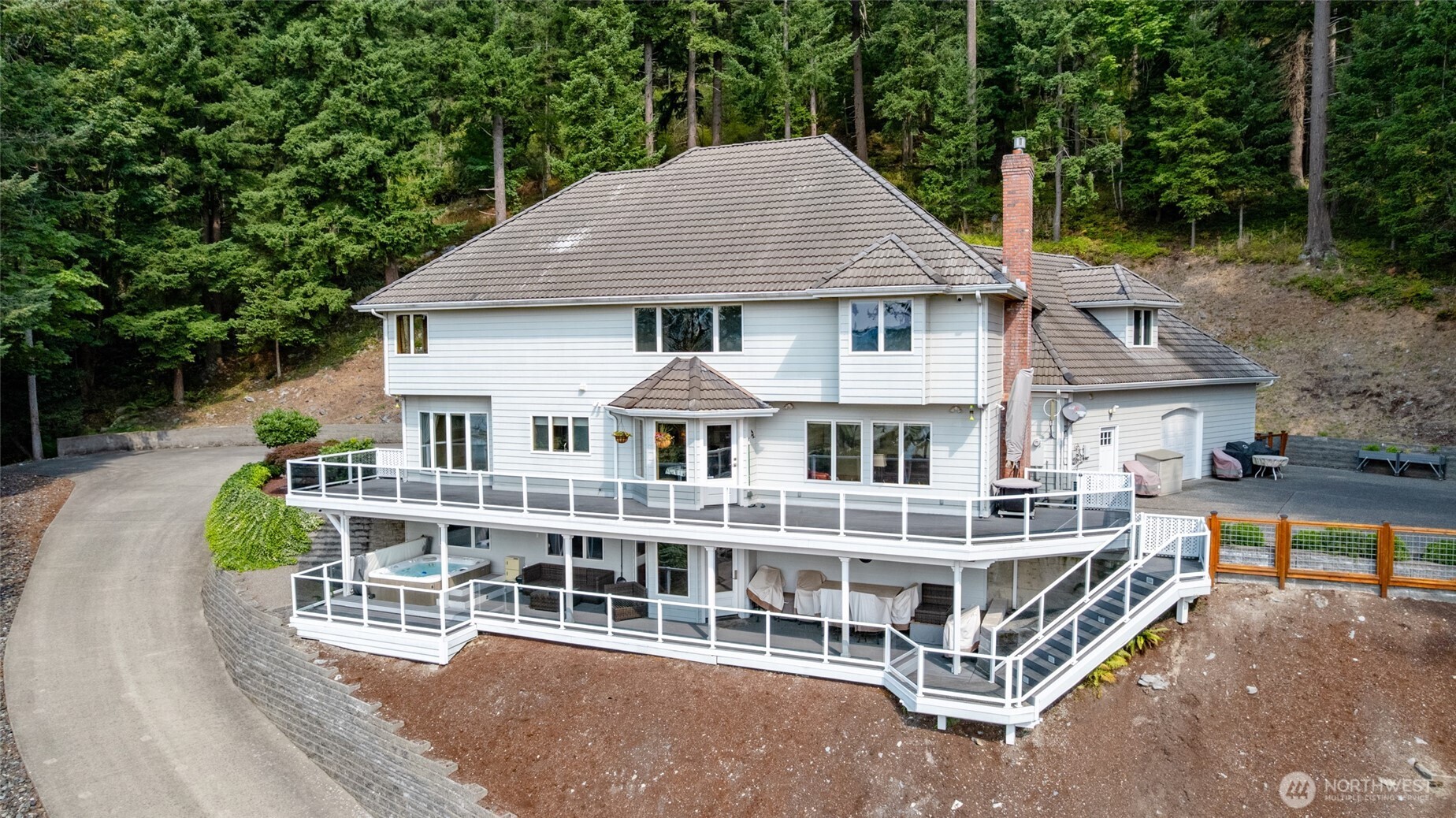 24123 Old Day Creek Road Sedro-Woolley, WA 98284 - Photo 2 of 40 an aerial view of a house with roof deck front of house