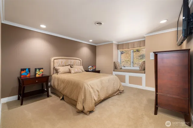 a bedroom with a bed and a window