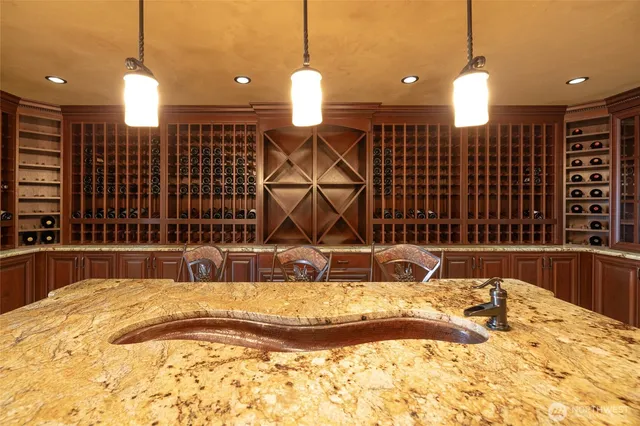 a room with furniture projector and screen