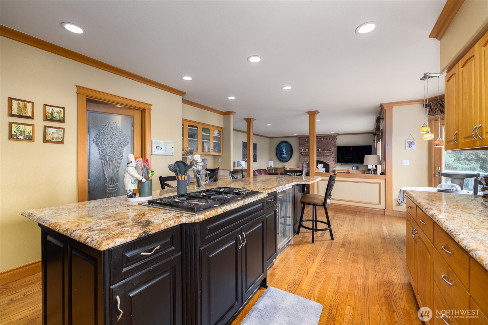 24123 Old Day Creek Road Sedro-Woolley, WA 98284 - Photo 8 of 40 a kitchen with granite countertop a stove a sink dishwasher and a refrigerator with wooden floor