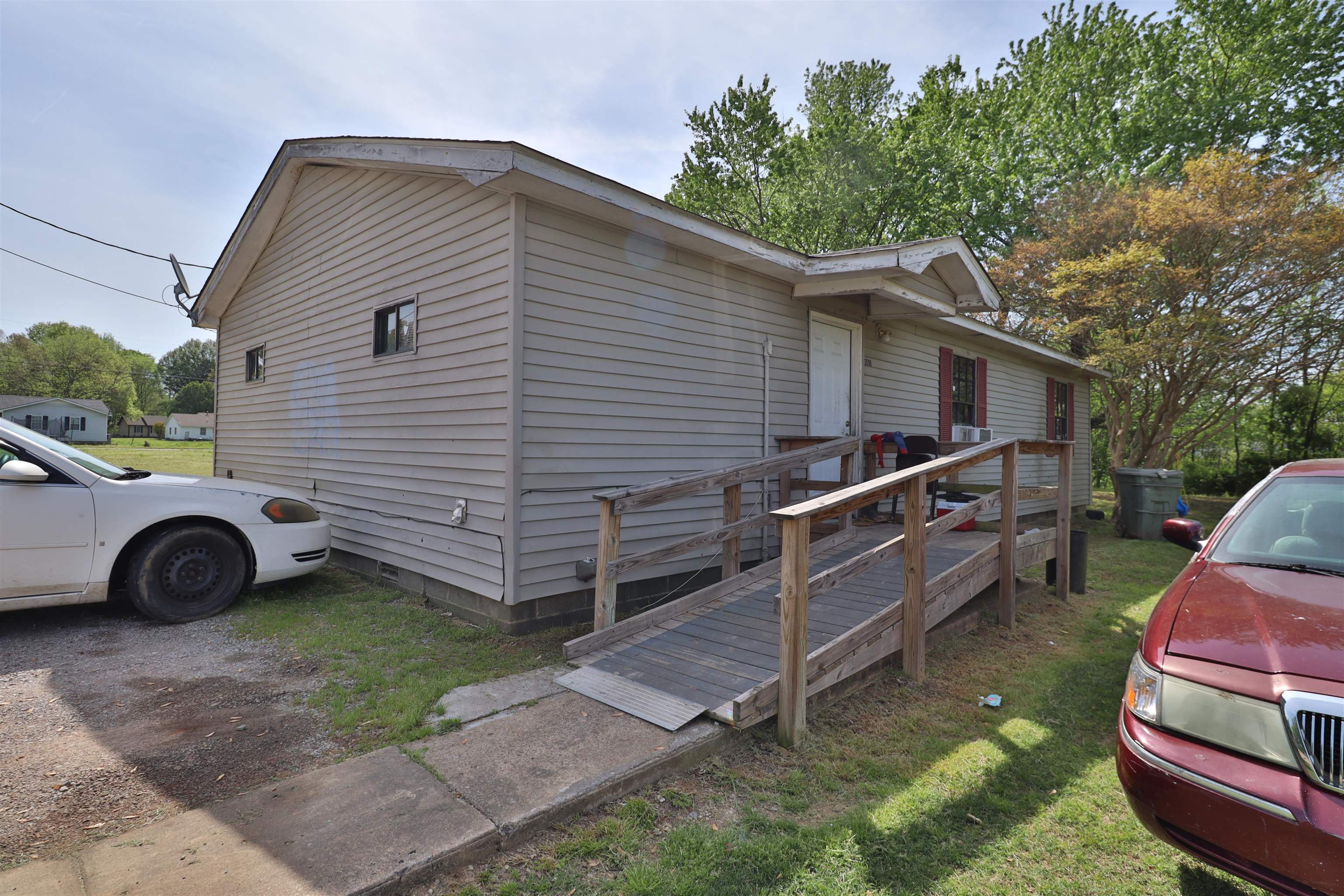 319 Wayne Avenue Ripley, TN 38063 - Photo 5 of 10 a view of a small car is parked in a yard
