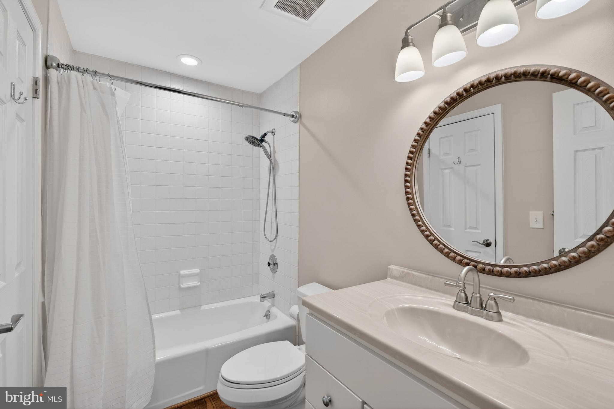 6 Nearfield Road Lutherville-Timonium, MD 21093 - Photo 55 of 71 a bathroom with a sink a toilet and a mirror
