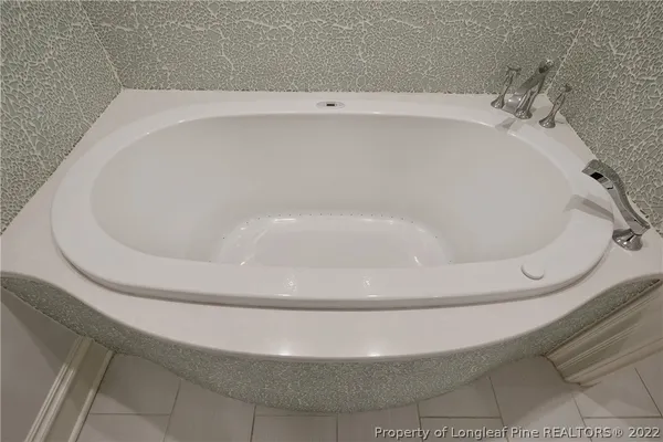 a close view of a bathtub in a bathroom