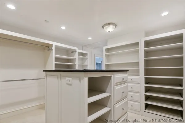 a view of an empty walk in closet