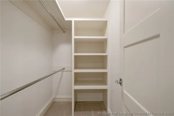 a view of an empty walk in closet