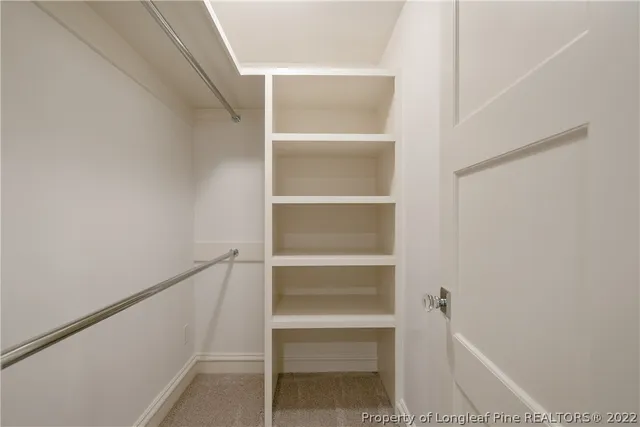 a view of an empty walk in closet