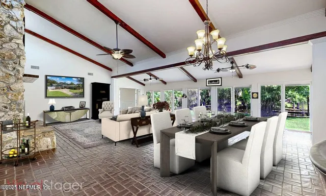 a view of a house with a yard patio and a garden