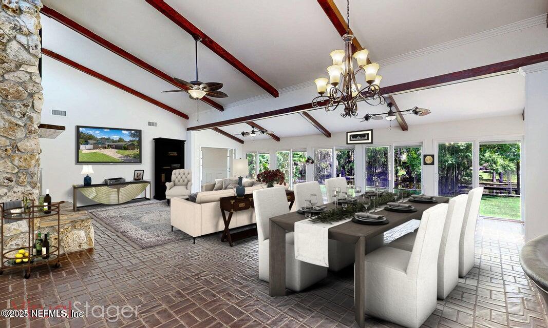 6433 River Point Drive Fleming Island, FL 32003 - Photo 13 of 71 a living room with furniture and a large window