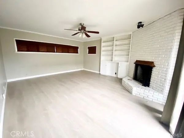 a view of a livingroom with furniture and flat screen tv