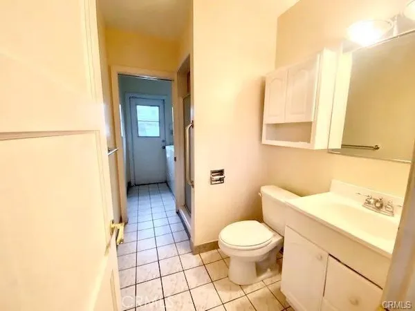 a bathroom with a sink a toilet and a shower