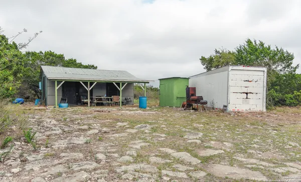 a view of a house with a yard and garage