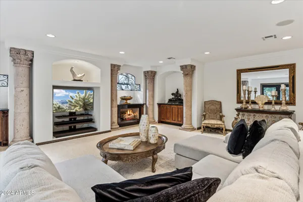 a living room with furniture and a rug