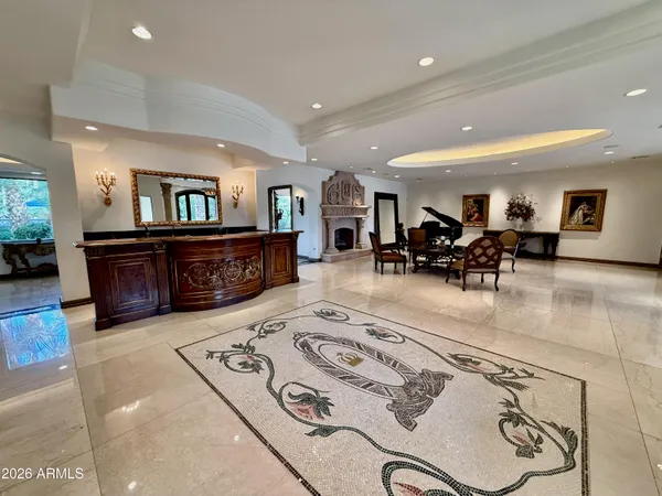 a living room with furniture and a fireplace