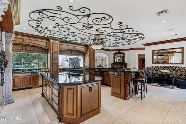 a kitchen with stainless steel appliances granite countertop a stove and a microwave