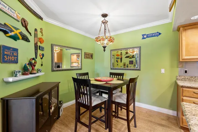 a view of a dining room with furniture and window