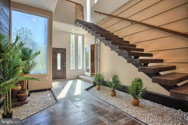 a view of a balcony with wooden floor and fence