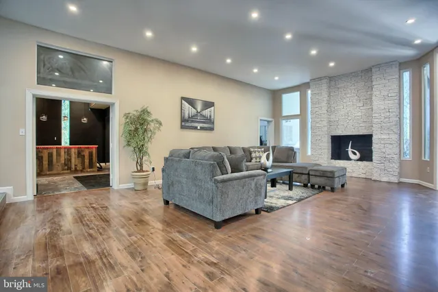 a living room with furniture and a fireplace