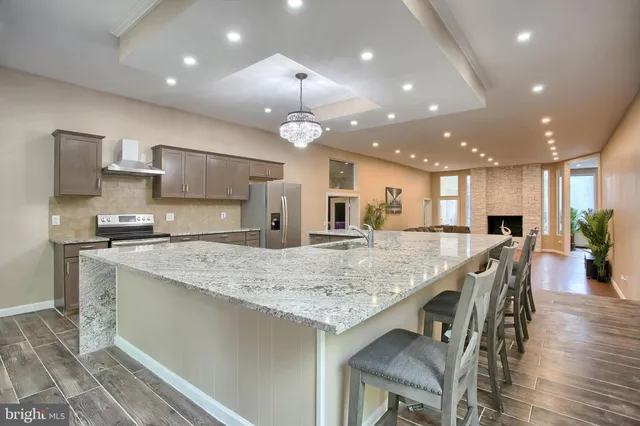 a kitchen with a stove and a refrigerator