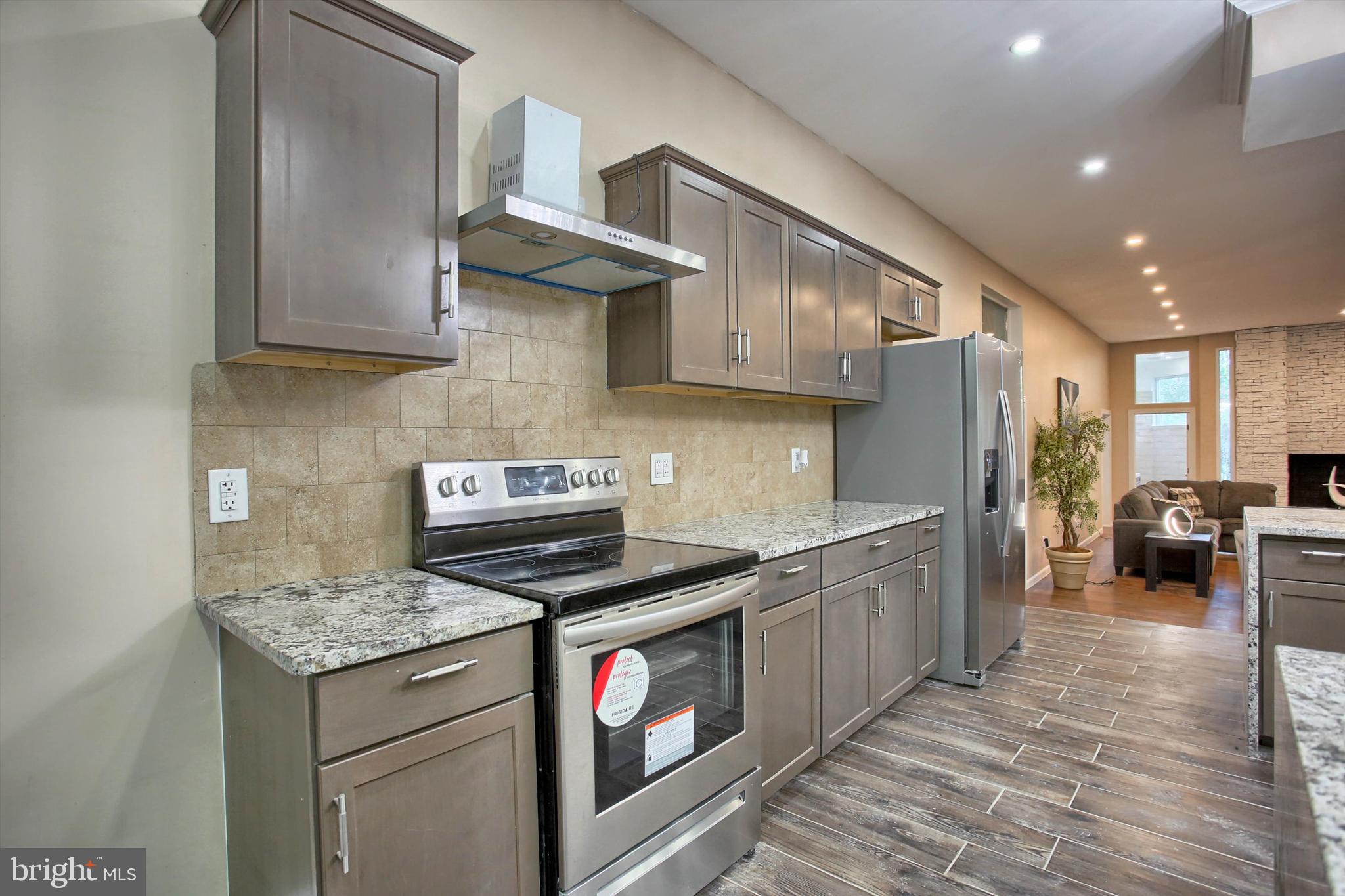 1813 Holly Drive Harrisburg, PA 17110 - Photo 27 of 61 a kitchen with a stove and a refrigerator