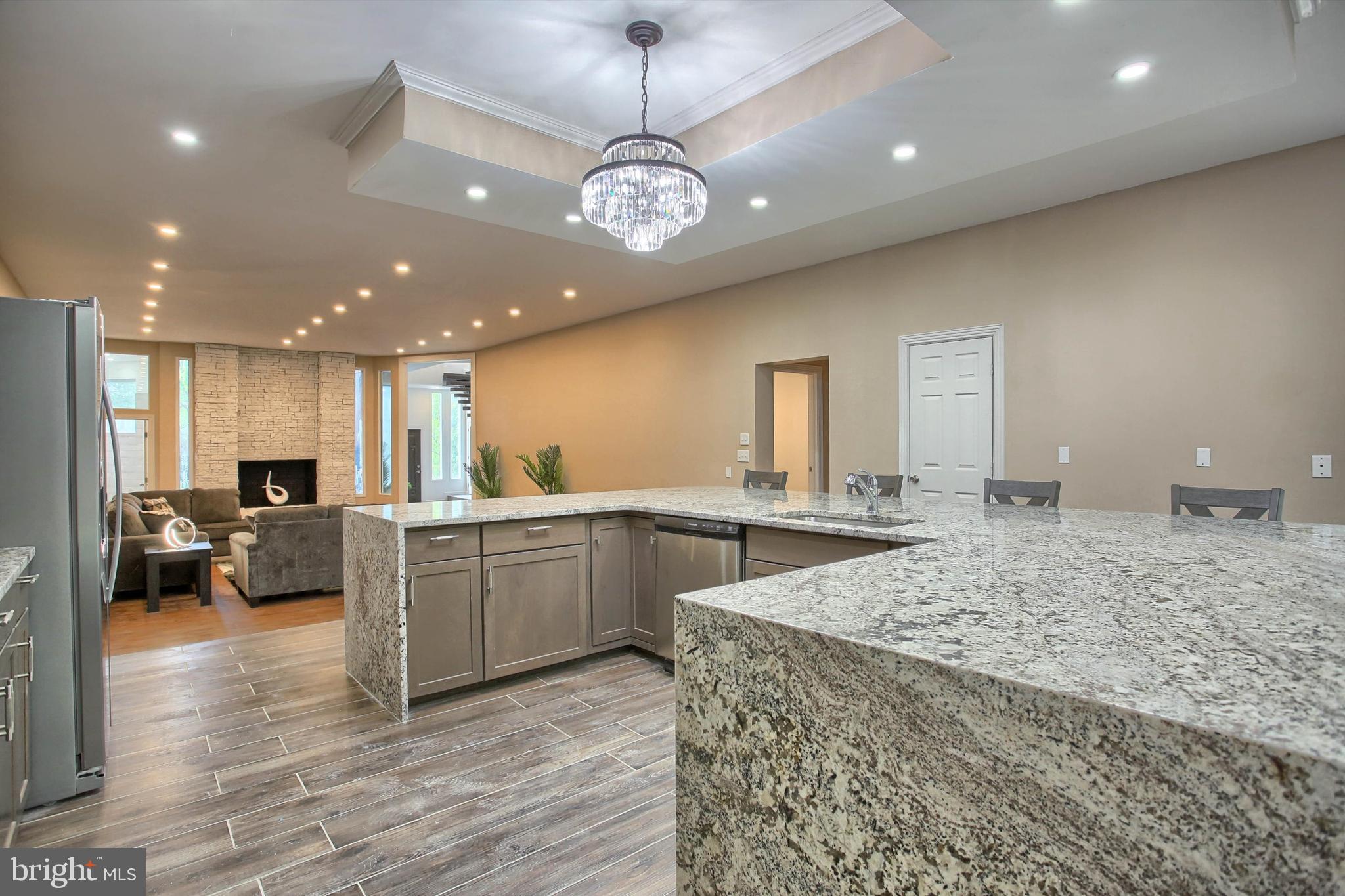 1813 Holly Drive Harrisburg, PA 17110 - Photo 29 of 61 a large kitchen with kitchen island a island a sink stainless steel appliances and cabinets