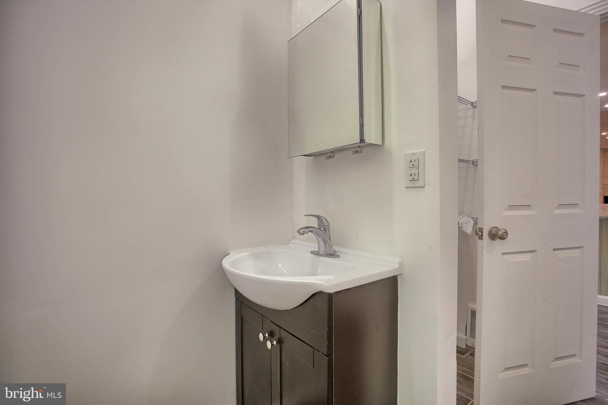 1813 Holly Drive Harrisburg, PA 17110 - Photo 32 of 61 a bathroom with a sink and a mirror