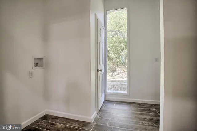 a bedroom with furniture and a wooden floor