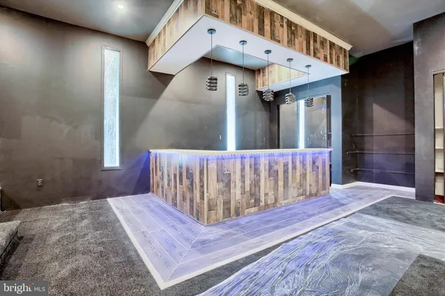 a bathroom with a double vanity sink mirror and bathtub