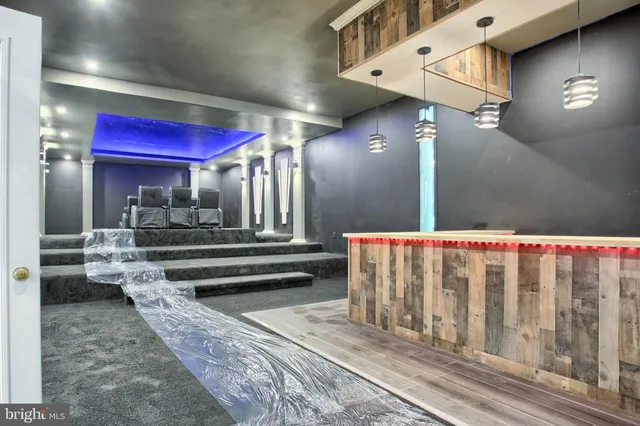 a bathroom with a double vanity sink a mirror and a bathtub