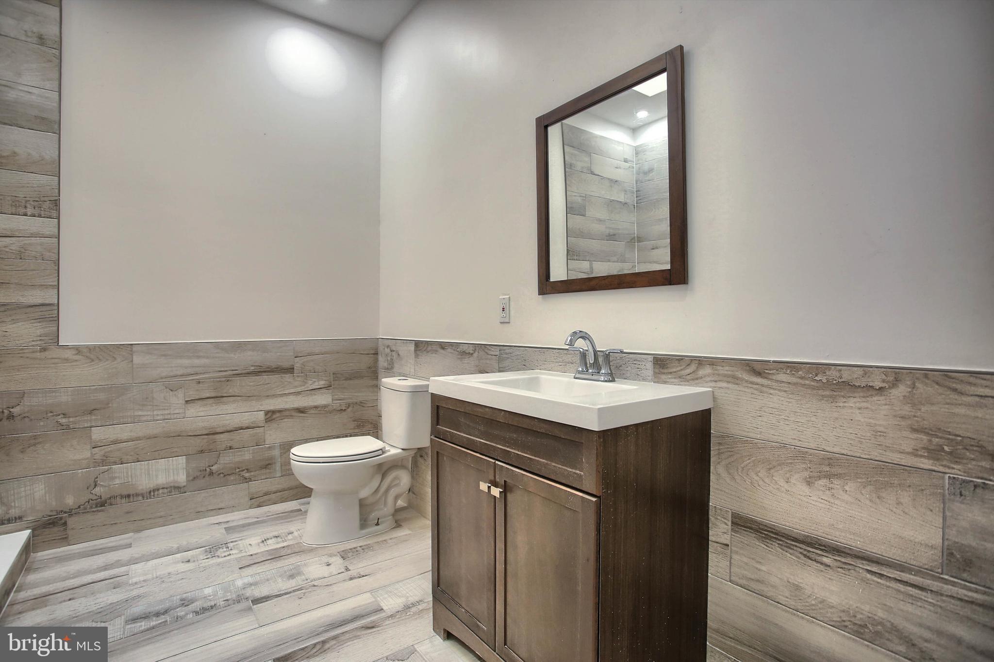 1813 Holly Drive Harrisburg, PA 17110 - Photo 47 of 61 a bathroom with a granite countertop sink mirror vanity and toilet