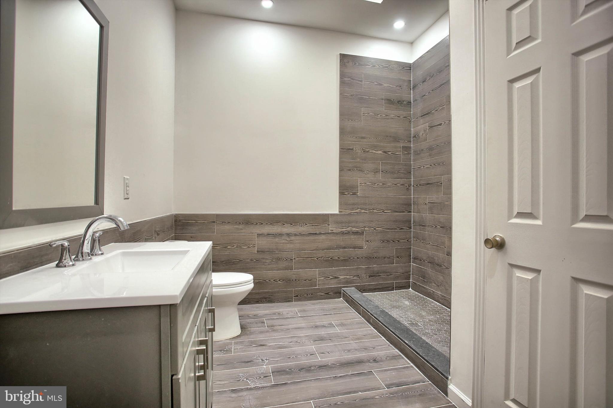 1813 Holly Drive Harrisburg, PA 17110 - Photo 48 of 61 a bathroom with a sink and a mirror