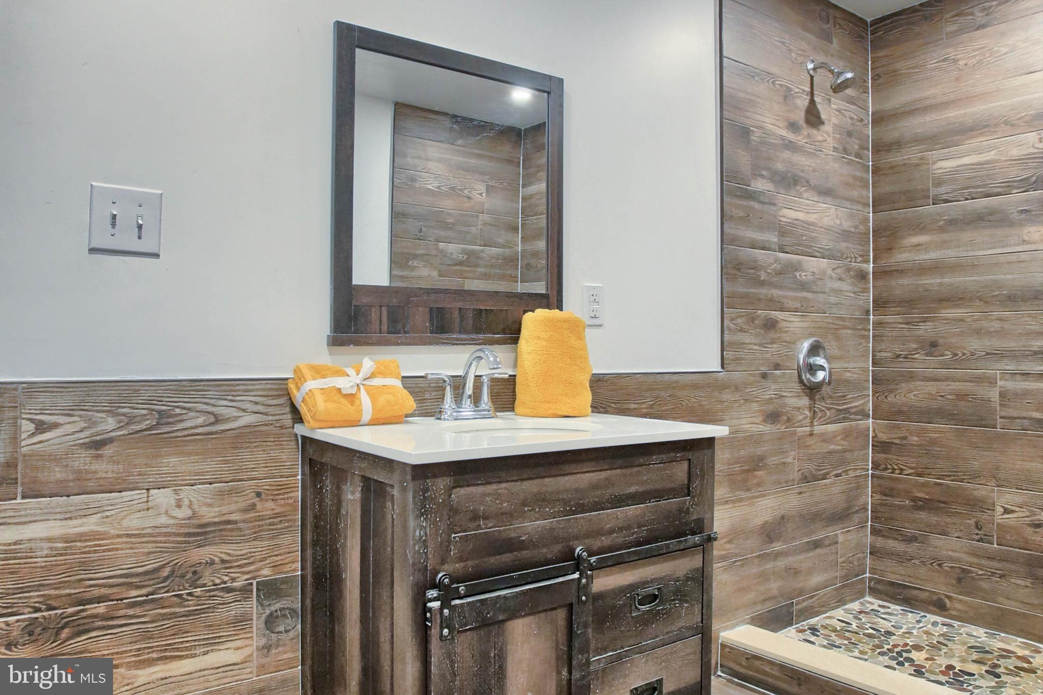1813 Holly Drive Harrisburg, PA 17110 - Photo 54 of 61 a bathroom with a sink and a mirror