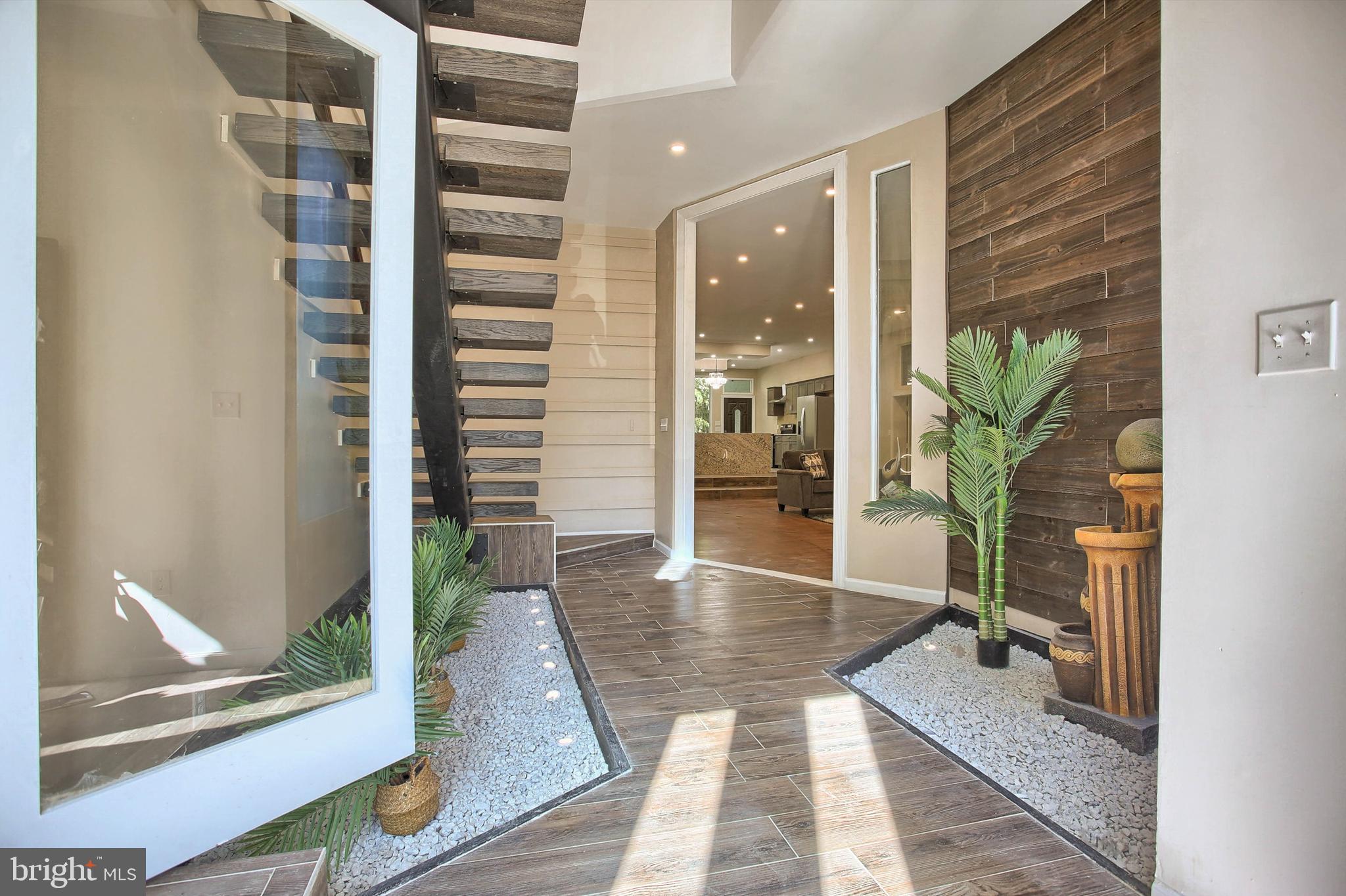 1813 Holly Drive Harrisburg, PA 17110 - Photo 9 of 61 a view of a hallway with wooden floor and a glass door