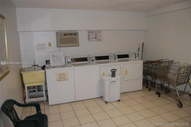 a utility room with cabinets